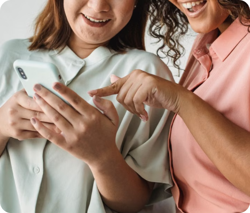 Two people looking at a phone together